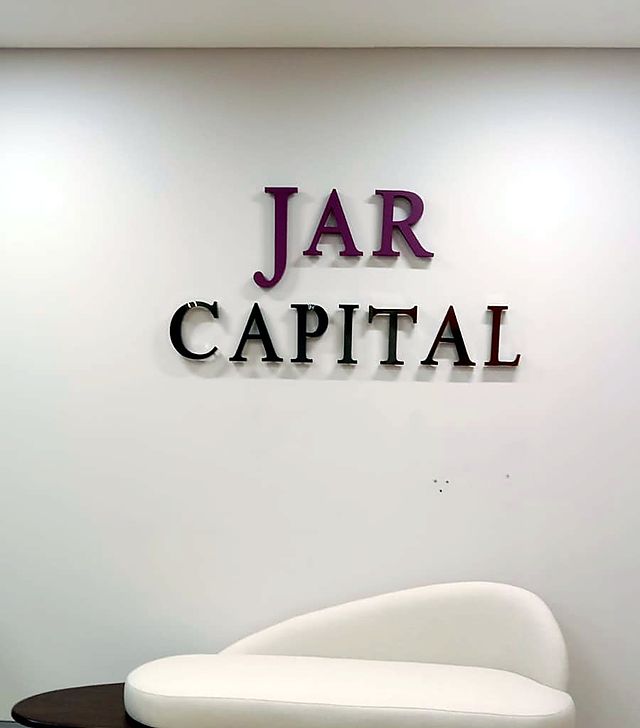 3D lettering in brand colours – Investment firm · reception lettering