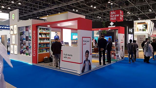 Education stand, show open – Education publisher · hanging sign, shelving and lightbox