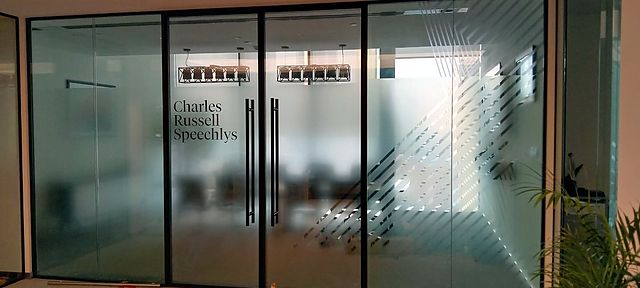 Frosted glass manifestation – Law firm · plotter-cut film with printed logo