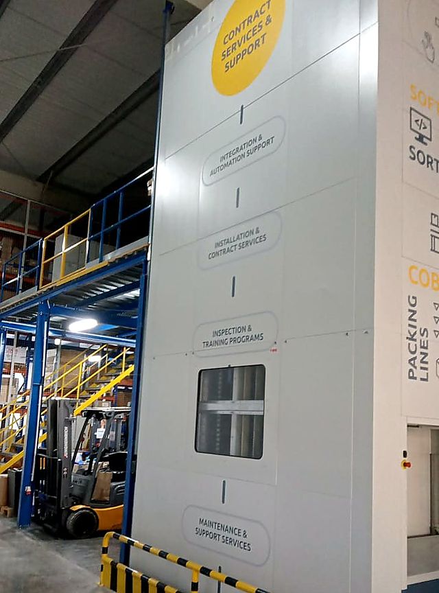 Floor-to-ceiling machine wrap – Logistics company · large-format graphics